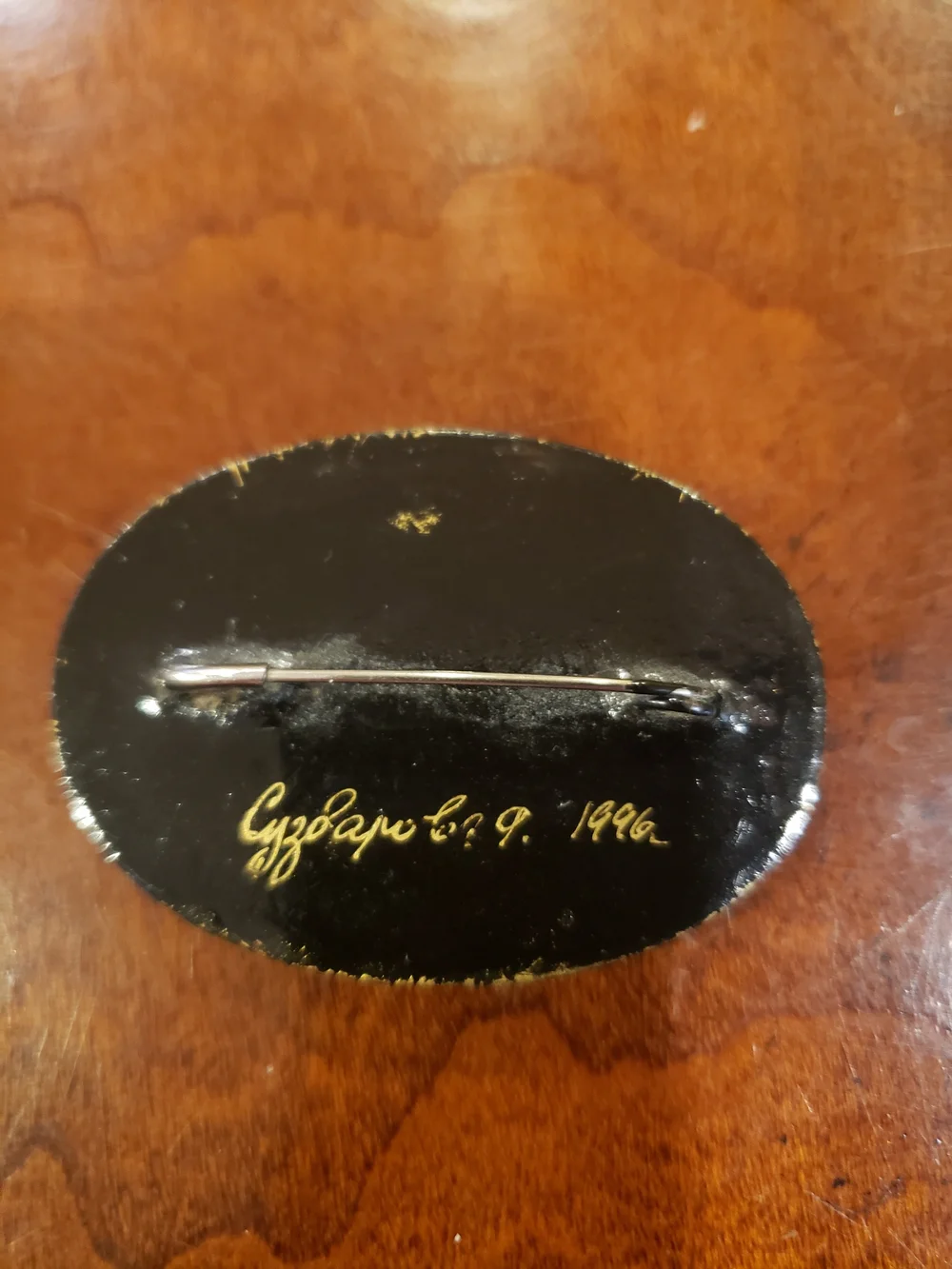 Vintage '96 Oval Black Floral Brooch with Gold Accents